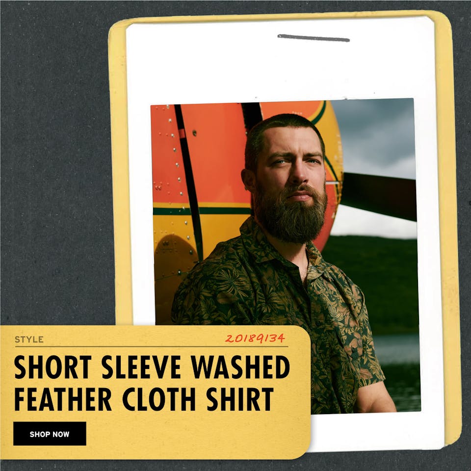an image of FIlson's short sleeve feather cloth shirt with the words 'Short sleeve feather cloth shirt' and a 'shop now' button superimposed onto the image